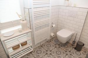 Koupelna v ubytování Lieblingsort + 12 fotografií