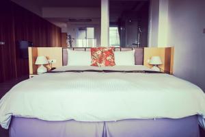 Voodi või voodid majutusasutuse Sasa Nor Lamour B&B toas