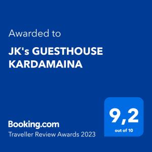 a blue sign with the text awarded to uks guesthouse karadj at JK's GUESTHOUSE KARDAMAINA in Kardamaina