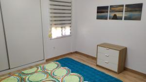 Łóżko lub łóżka w pokoju w obiekcie Atractivo apartamento en la playa con parking