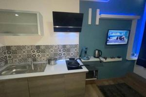 Kuchyň nebo kuchyňský kout v ubytování Le prestige centre-ville de Douai