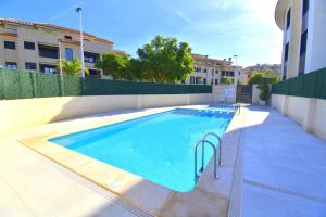 a swimming pool in the middle of a building at 5056 Apartamento Nuba Javea in Jávea