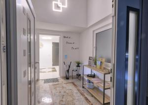 a room with a hallway with a table and a mirror at 47 Heaven Luxury House in Radovljica