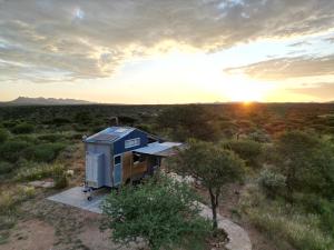 an aerial view of a tiny house in the desert at BellaTiny, Tiny House & Gypsy Wagon in Ondekaremba