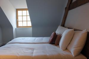 Postel nebo postele na pokoji v ubytování De Kasteelhoeve