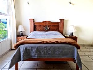 Łóżko lub łóżka w pokoju w obiekcie Departamento Vintage Querétaro