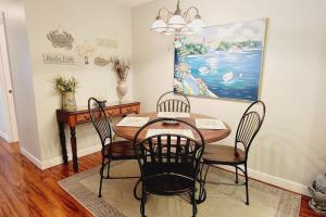 a dining room with a table and chairs at E10 comfortable and neat 2 bedroom 2 bath in Saint Simons Island