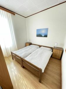 a bedroom with a large bed in a room at Hotel Bellavista Cavigliano in Cavigliano