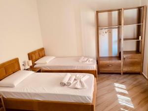 Postel nebo postele na pokoji v ubytování ELMA Guest House