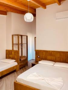 Postel nebo postele na pokoji v ubytování ELMA Guest House