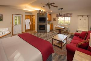 a bedroom with a bed and a living room at Hawk Valley Retreat & Cottages in Galena