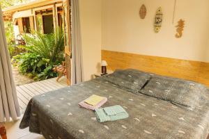 Postel nebo postele na pokoji v ubytování Suites surf house itamambuca