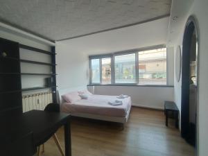A bed or beds in a room at Gelsomino B&B Apartment