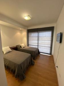 Un pat sau paturi într-o cameră la Hermoso departamento de 2 habitaciones, en Salta Capital