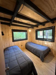 Krevet ili kreveti u jedinici u objektu Cabaña Chucao, Nativo Lodge