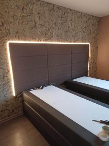 Posteľ alebo postele v izbe v ubytovaní Appartement Gauche avec balcon