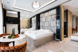 Łóżko lub łóżka w pokoju w obiekcie Salomea apartments Kraków, Stary Kazimierz, Tauron arena