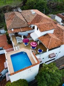 an aerial view of a house with a swimming pool at Pousada da Seresta in Diamantina