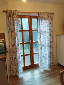 Kuchyň nebo kuchyňský kout v ubytování Liliomfa apartman