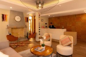 a man standing at a bar in a living room at Torre Dorada Cusco in Cusco