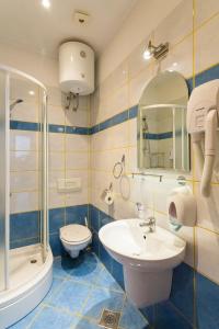 a bathroom with a sink and a toilet and a shower at Apartment& Room Lukre / Apartment Lukre with terrace in Dubrovnik