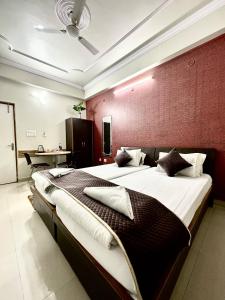 Ein Bett oder Betten in einem Zimmer der Unterkunft Hotel Buddha International