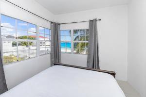 Postel nebo postele na pokoji v ubytování CocoVaa Beach Boutique Hotel