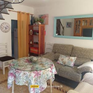 a living room with a couch and a table at El Cordobes in Córdoba