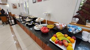 a buffet line with many different types of food at Hotel Diego De Almagro Talca in Talca