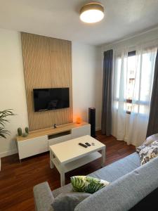 a living room with a couch and a tv at Apartamento Fatima in Santa Cruz de la Palma