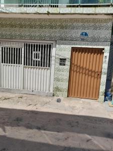 two doors on the side of a building at Apto em São Bráz in Belém