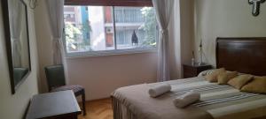 Postel nebo postele na pokoji v ubytování TORRE BARRANCAS DE BELGRANO