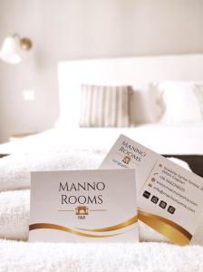 Letto o letti in una camera di Manno Rooms Affittacamere