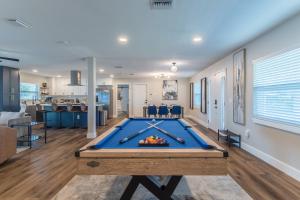 a pool table in the middle of a room at Lake House Retreat Near Downtown, Disney, Universal Studios and Airport in Orlando