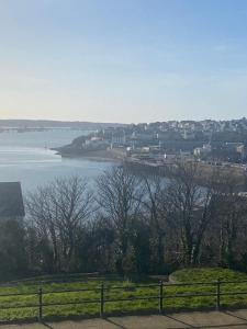 a view of a large body of water with a town at Flat 3, Murray Crescent House in Milford Haven