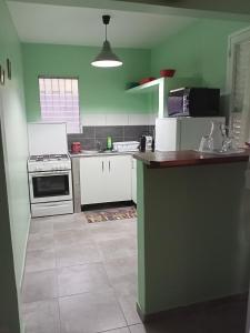 Kuchyň nebo kuchyňský kout v ubytování Paradis Caché - Confort Terrasse - Kybo Karaib Location - pkg - Mtgne