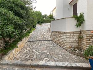 a stone walkway in front of a house at Villa Eugenia in Košljun