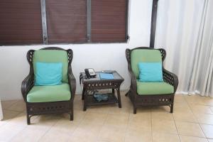 two chairs and a table with a phone on it at Point Pleasant Resort in Nazareth
