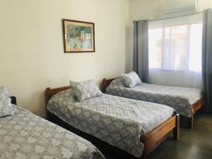 Postel nebo postele na pokoji v ubytování Hotel Del Aserradero