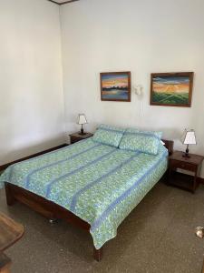 Postel nebo postele na pokoji v ubytování Hotel Del Aserradero
