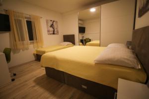 Posteľ alebo postele v izbe v ubytovaní Holiday home Zadar