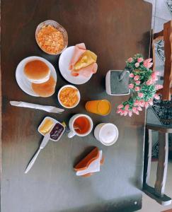 a painting of food on a table with plates of food at Hotel Plaza Colon in Arica