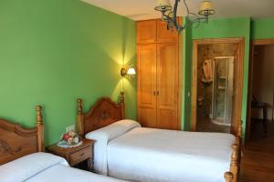 A bed or beds in a room at Posada Sobrevilla
