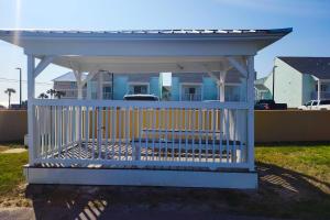 a white gazebo in front of a house at Wendwood Condominiums F2 in Panama City Beach