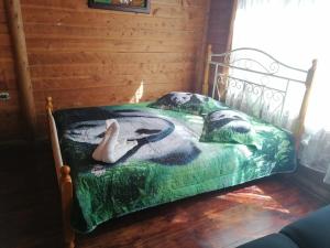 a dog laying on a bed in a room at Finca pedacito de cielo in Paraíso