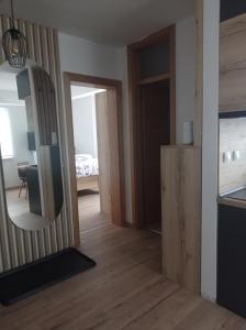a mirror in a room with a bedroom at Apartmani NIX VIR in Jahorina +15 photos