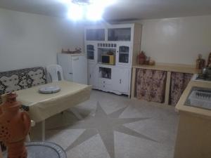 a kitchen with a table with a star on the floor at شقة المنظر الجميل in Midelt