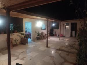a large room with a patio at night at شقة المنظر الجميل in Midelt