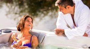 a man and a woman sitting in a bath tub at Domus Antiqua Bed & Breakfast in Spello