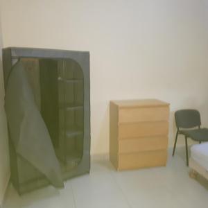 a television and a dresser in a room at ZAC MBAO - Cité enseignants in Kammba +4 photos